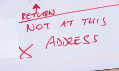 Close up of an envelope, on which is written in red pen 'Return - not at this address'
