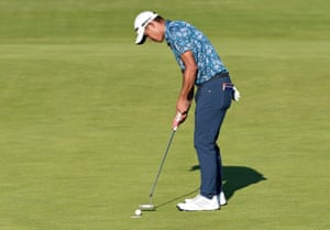 Collin Morikawa of the U.S. holes his putt on the 18th green to win The Open Championship.