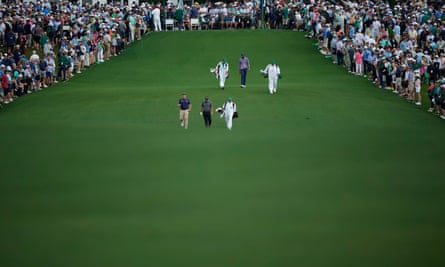 Sepp Straka, of Austria, Phil Mickelson and Tony Finau walk on the first hole during the first round at the Masters golf tournament at Augusta National Golf Club Thursday, April 11, 2024