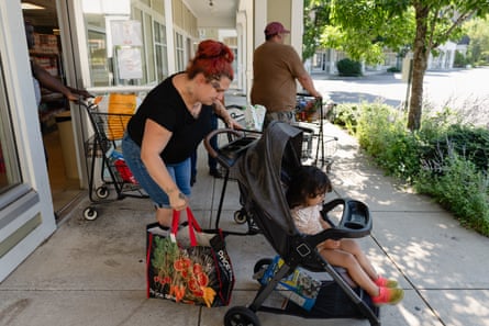 A women carrying a bag and a stroller