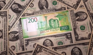 Russia-Ukraine war latest news: US condemns Putin’s nuclear deterrence order; rouble crashes as markets open – live updates | World news 4 Russian Rouble banknote is placed on U.S. Dollar banknotes in this illustration taken, February 24, 2022. REUTERS/Dado Ruvic/Illustration
