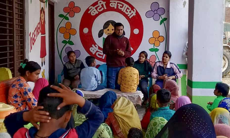 Sunil Jaglan, the anti-swearing campaigner talks to women and children in the village of Sarmathla, India.
