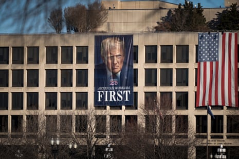 A giant portrait of Donald Trump hangs on the labor department headquarters in Washington DC.
