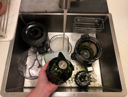 Hurom H70 Easy Clean Slow Juicer being cleaned