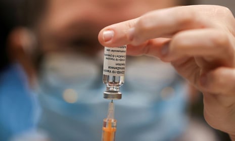 A health worker draws a dose of the AstraZeneca vaccine in Newcastle.