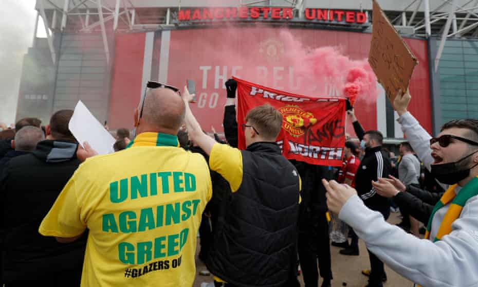 Manchester United fans protest against their owners before the Liverpool game that ended up being postponed. 