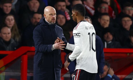 Marcus Rashford shakes hands with manager Erik ten Hag after being substituted.