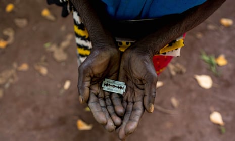 A woman in Kenya shows the razorblade she uses to cut girls’ genitals