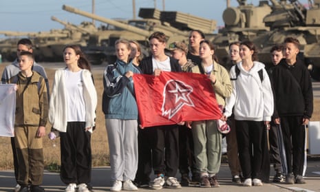 Schoolchildren hold a flag of Young Army Cadets National Movement in Sevastopol on 28 October.
