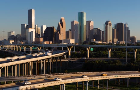 Elevated highways in front of the Houston skyline. Bayous pass underneath, creating freeways for the city’s cyclists.