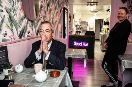 A quiet moment for Farage while out campaigning and meeting supporters in Felixstowe, Suffolk, 23 March.