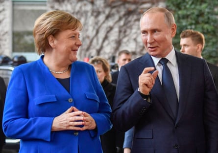 The then German chancellor, Angela Merkel, greeting Russia’s Vladimir Putin at a peace summit on Libya in Berlin in 2020.