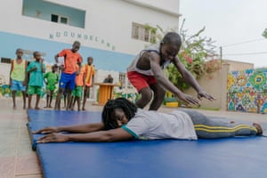 Adji Mbene Lam gives acrobatics classes at the Empire des Enfants, an emergency shelter for street children in Dakar.