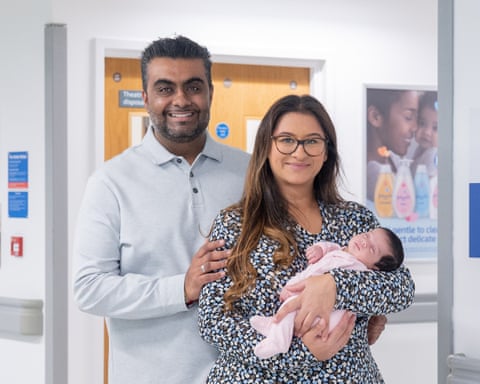 Amisha and Nik Adhia with their baby, Ishaani.