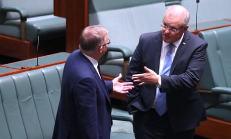 Scott Morrison and Anthony Albanese speak during voting in the House of Representatives on Tuesday.