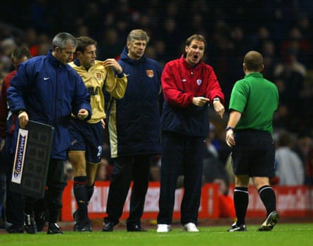 Phil Thompson moans to referee Paul Durkin as Arsene Wenger prepares to bring on Matthew Upson for the last few minutes.