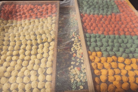 Fresh orecchiette dries in the sun on a street in Bari