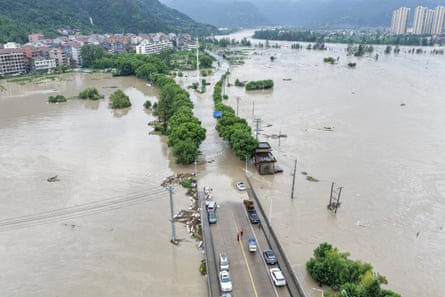 Aerial view of flooded land both sides of a road