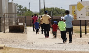 Immigrants seeking asylum at an ICE residential centre in Texas. A US judge has ruled children held with their parents in immigration jails must be released.