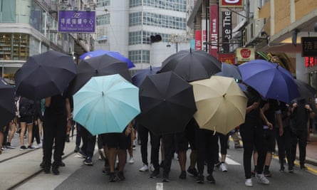 Protesters form a shield with umbrellas during a protest against the Chinese national security law in Hong Kong in July.