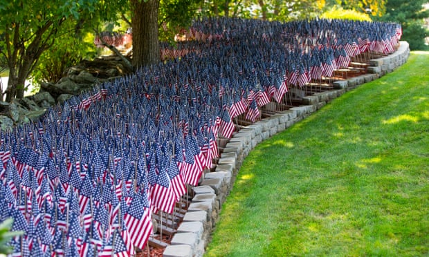 More than 8,000 flags, representing the number of Covid-19 deaths in Massachusetts, in the yard of Mike Labbe in Grafton, Massachusetts.
