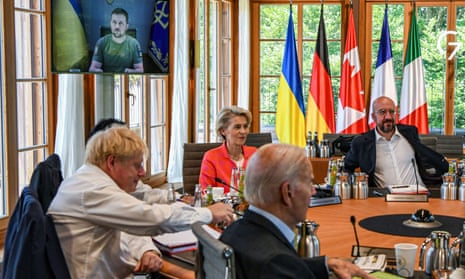 Volodymyr Zelenskiy is seen on video addressing G7 leaders during their working session in the Bavarian Alps on Monday