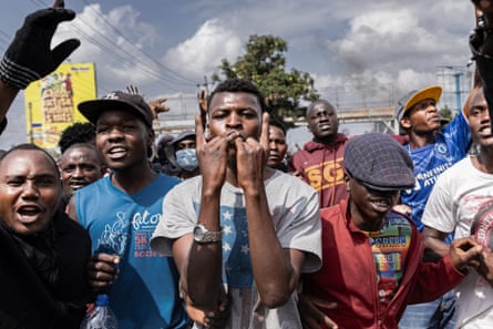 Young protesters making chants and gestures of determination to the camera