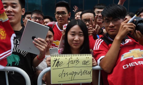 Manchester United fans show their feelings after the pre-season friendly against Manchester City in Beijing was called off due to the state of the pitch