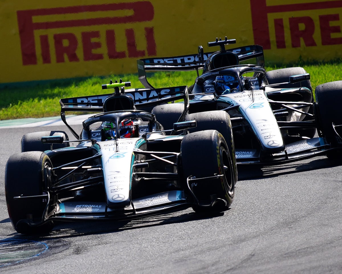 Kimi Antonelli (left) battles with teammate George Russell during the Italian Grand Prix