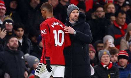 Manchester United’s Marcus Rashford with manager Erik ten Hag after being substituted against Spurs