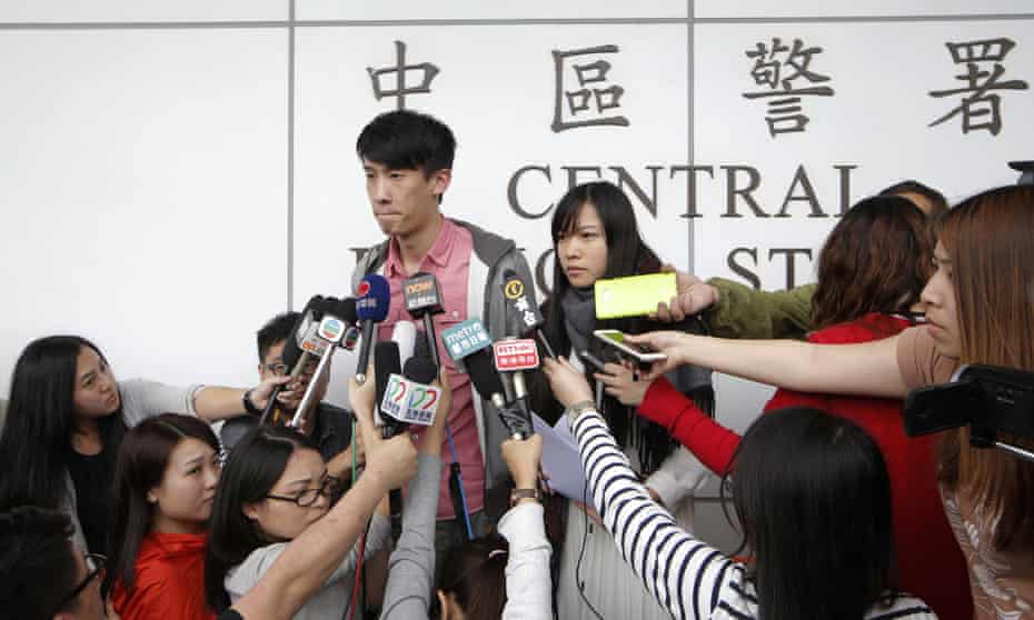 Pro-independence lawmakers Sixtus Leung and Yau Wai-ching speak to the media outside a police station in Hong Kong on Wednesday. Nine other democracy activists have now been arrested.