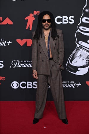 Lenny Kravitz remembered his buttons but forgot his shirt when putting on his Saint Laurent suit.