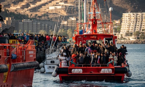 People arrive at the overcrowded port of Arguineguín, Gran Canaria