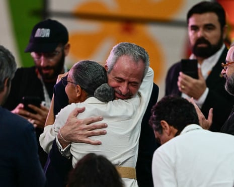 Corrêa do Lago embraces Silva.