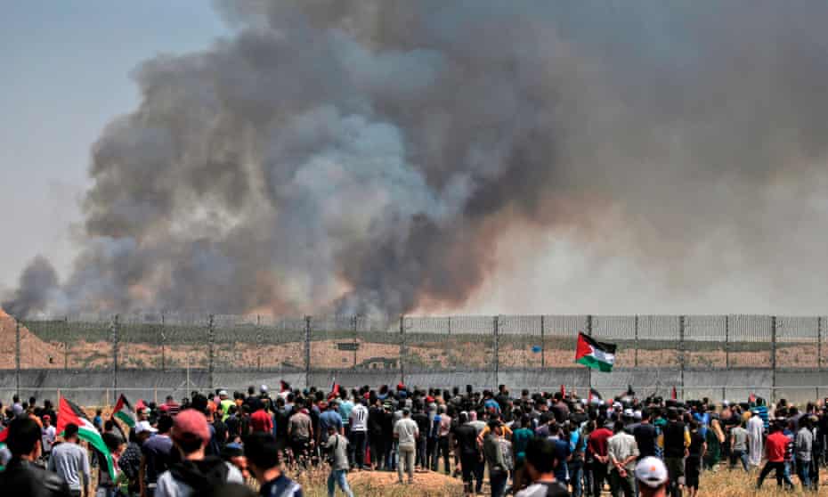 Palestinian protesters near the border fence east of Gaza City