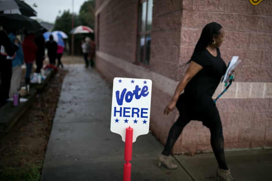 Residents of Charlotte, North Carolina, arrive at a polling station to vote.