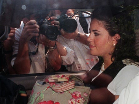 Monica Lewinsky in ca car surrounded by photographers