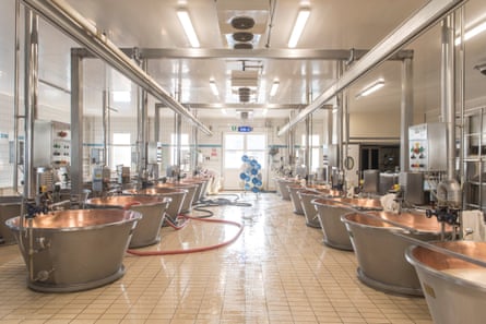 copper vats in the production of parmigiano reggiano inside the San Girolamo dairy.