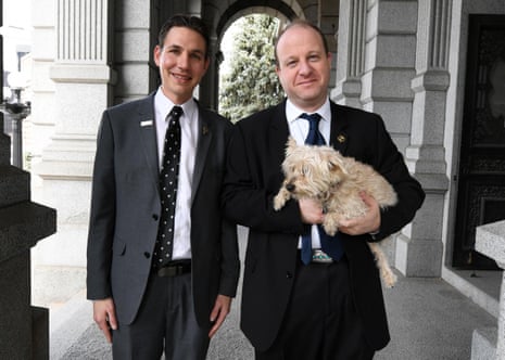 Governor Jared Polis, right, and first gentleman Marlon Reis, with their dog Gia at the statehouse.