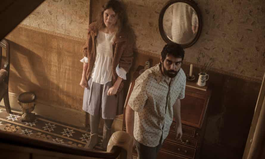 Carla Juri and Alec Secareanu in Amulet.