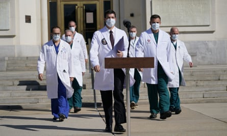 Sean Conley, physician to President Donald Trump and other doctors walk out to talk with reporters at Walter Reed National Military Medical Centre.