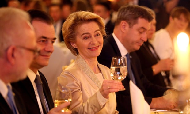  Ursula von der Leyen, president of the European commission, beside the Romanian prime minister Ludovic Orban (left) at a state dinner in Munich