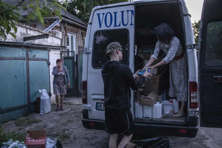 Volunteers deliver aid supplies to Ukrainian fighters in Sloviansk, Ukraine.