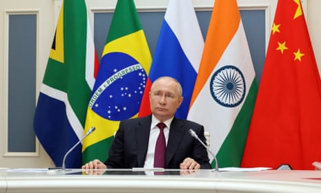 Vladimir Putin listens to leaders from Brics at the start of a summit in Johannesburg, South Africa, via videoconference from Moscow in 2023.