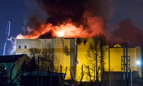 Flames leap from the shopping complex in Kemerovo.