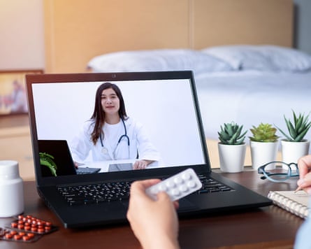 A patient during a video conference with a doctor.