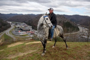 Justin Patrick, 17, sits atop a Rocky Mountain horse above the city of Pikeville, a sturdy breed of horse that, despite its name, was bred in the mountains of Kentucky to navigate the rough terrain of steep mountains and river valleys. Justin has no plans to enter coal mines after finishing high school.