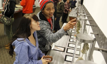 Shoppers browse legal recreational marijuana sales in Portland, Oregon.