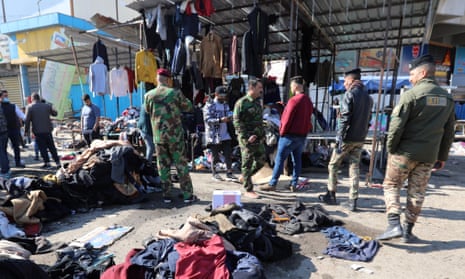 Security forces at market with clothes on ground