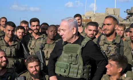 Benjamin Netanyahu meets with Israeli soldiers on Wednesday, near Israel’s border with Gaza.